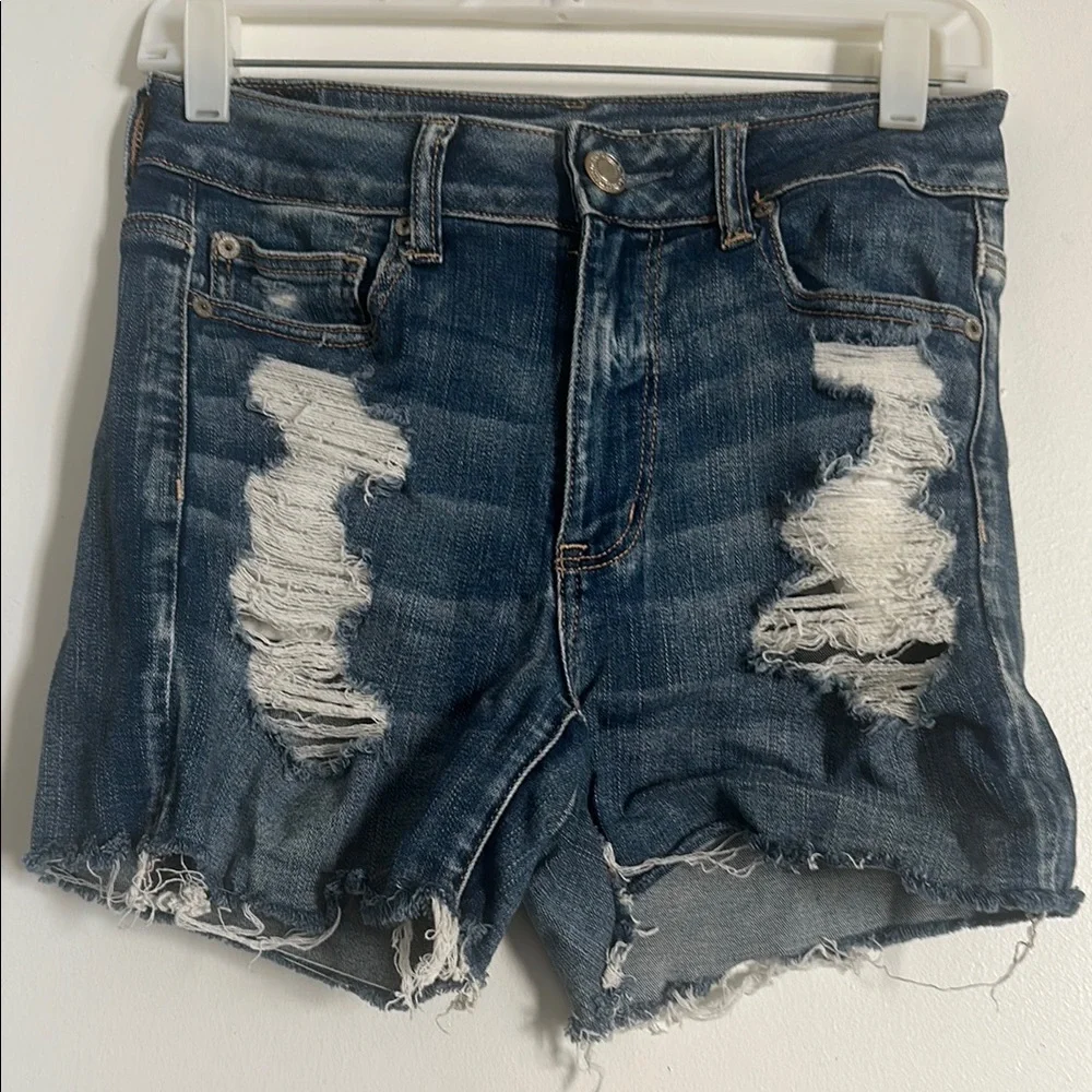 EUC American Eagle Next Level Stretch Blue Distressed Jean Shorts with Raw Hem - Picture 2 of 5